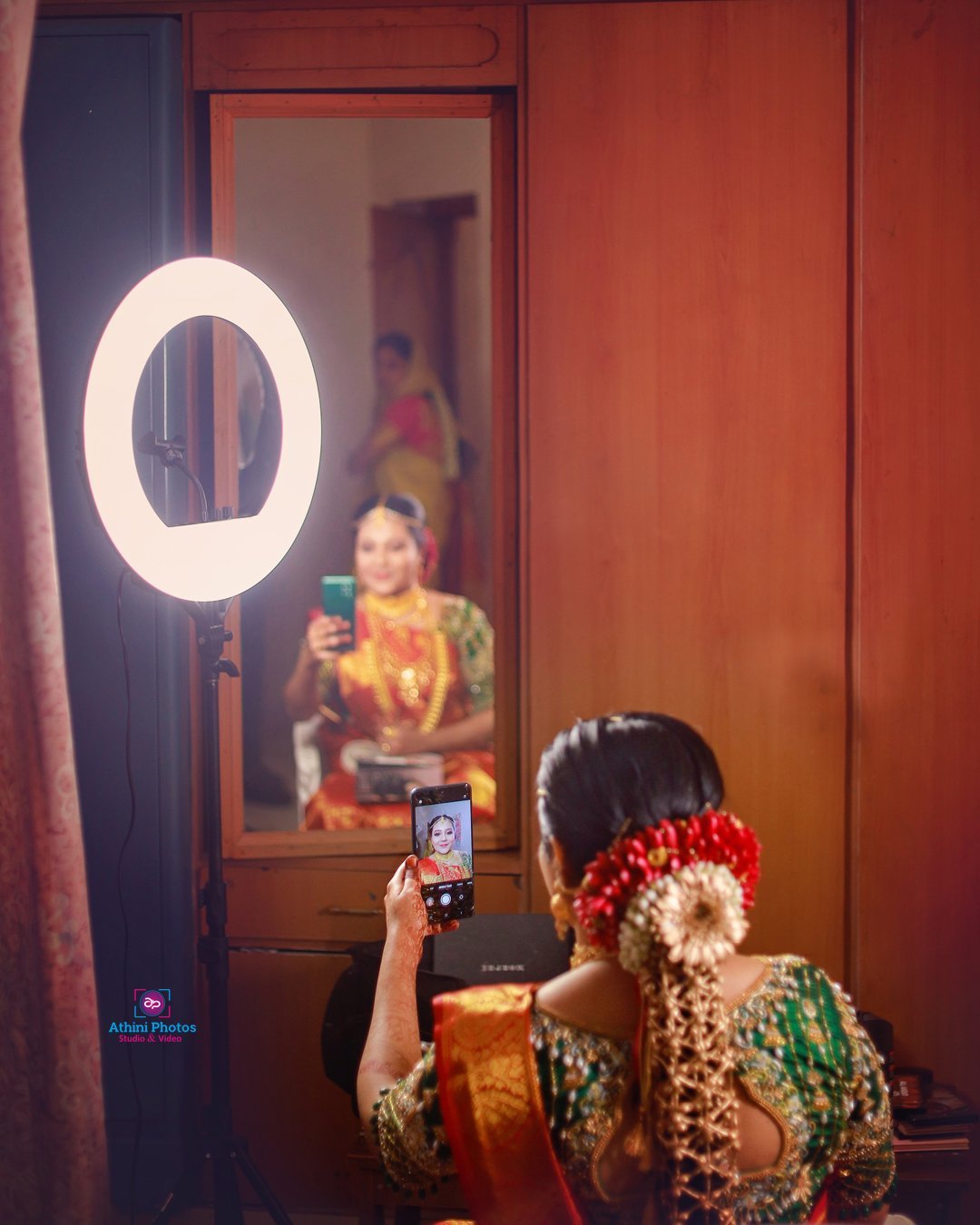 Traditional Muslim wedding bride capturing a selfie with her phone.
