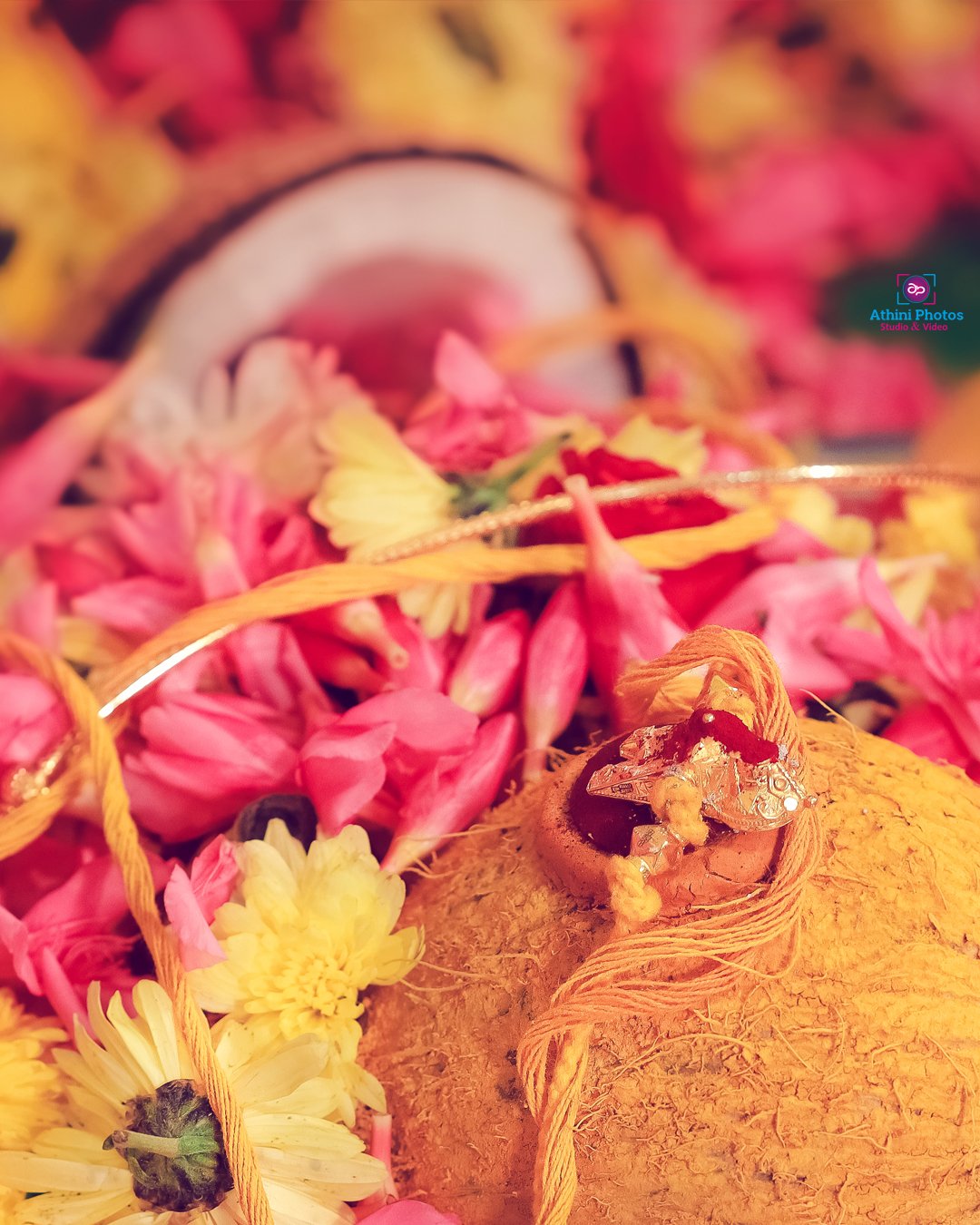 A close-up of a coconut and flowers, beautifully arranged for a wedding photoshoot.