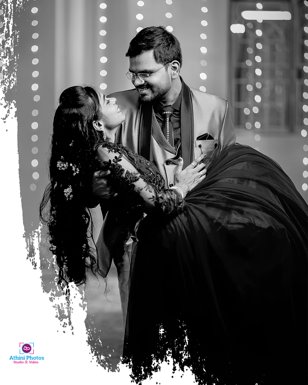 A beautiful bride and groom exchanging vows under a flower arch with their loved ones surrounding them.