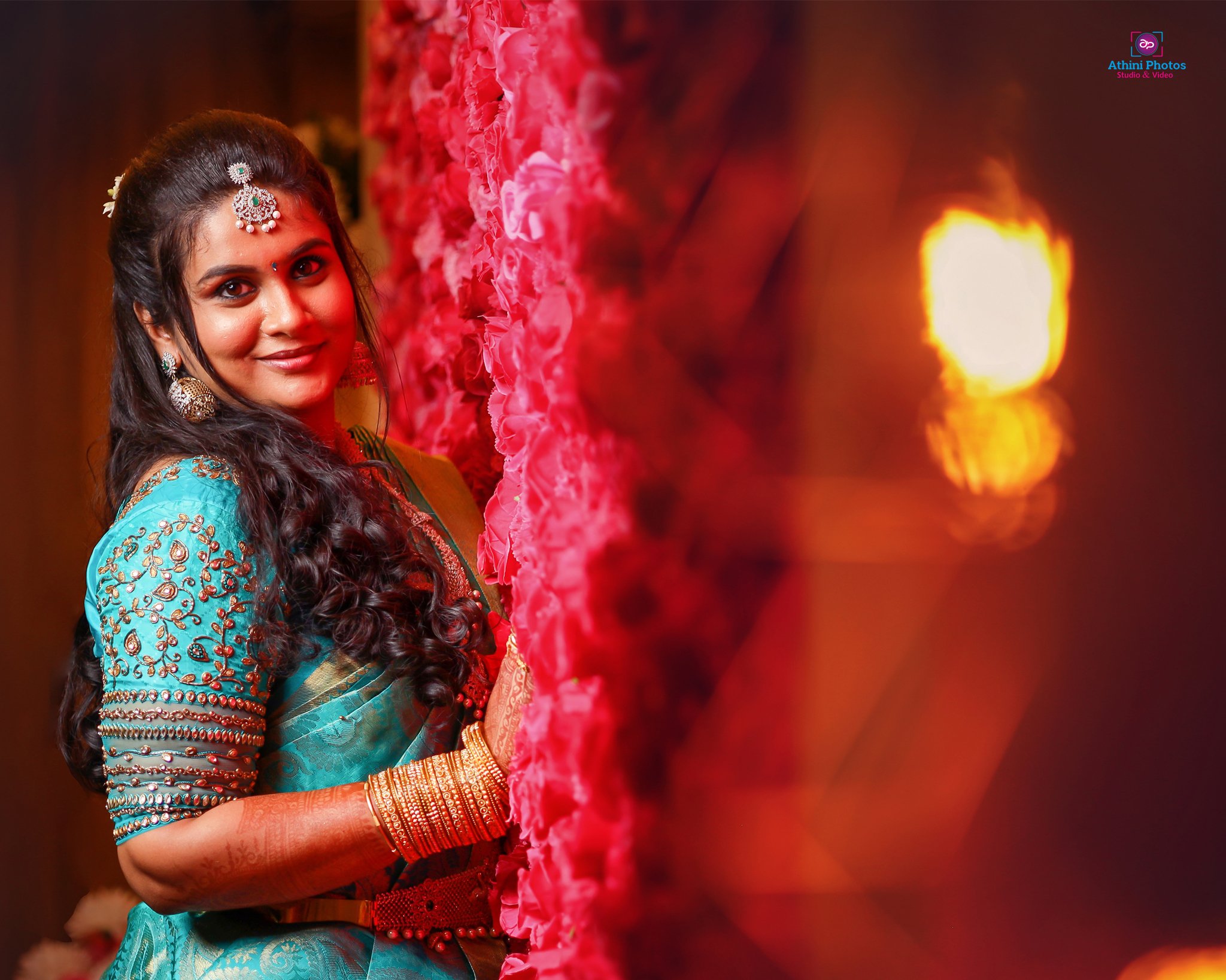 Captivating image of Indian bride in blue sari taken during wedding photoshoot.