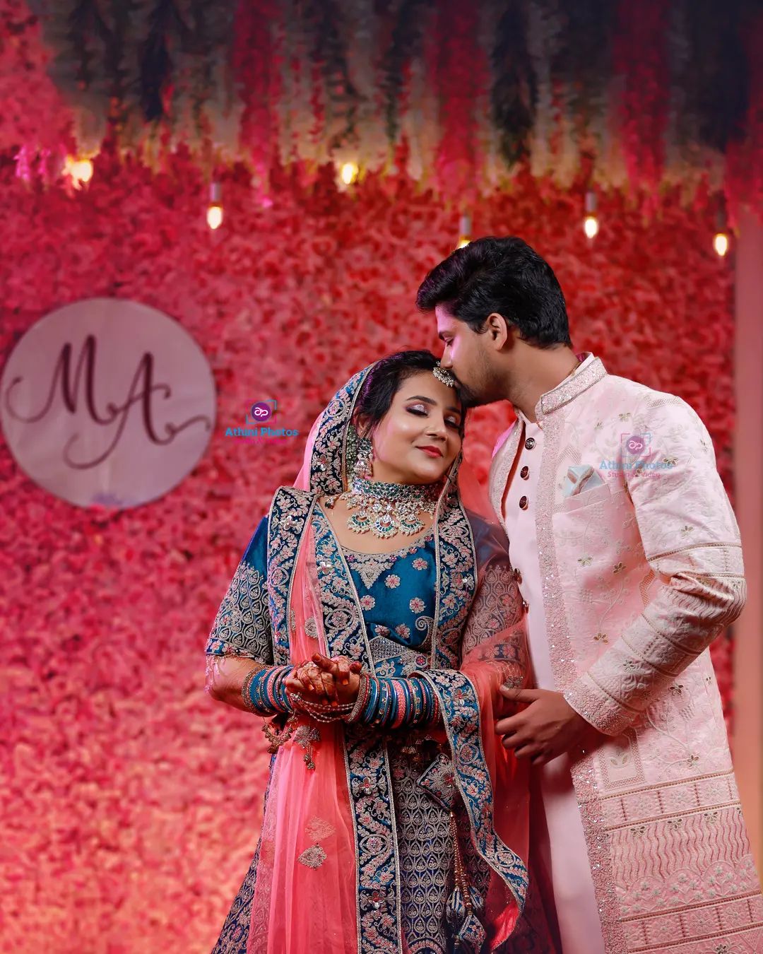 After becoming husband and wife, beautiful east Indian bride and groom pose  outside together